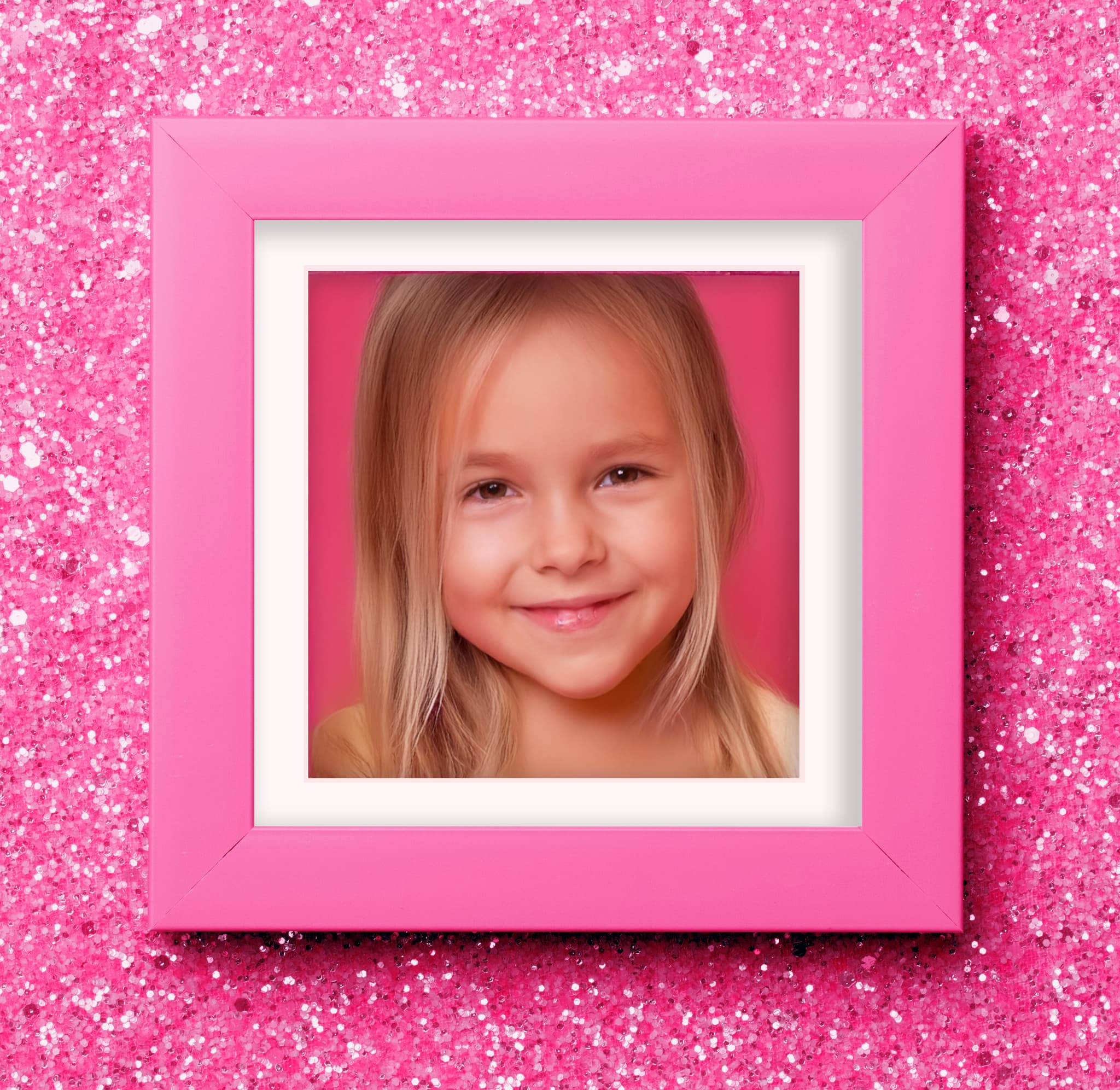 Pink Wood gallery wall featuring playful art including cupcakes unicorns kittens and abstract prints arranged over white shelf showcasing whimsical pink styling for children's spaces
