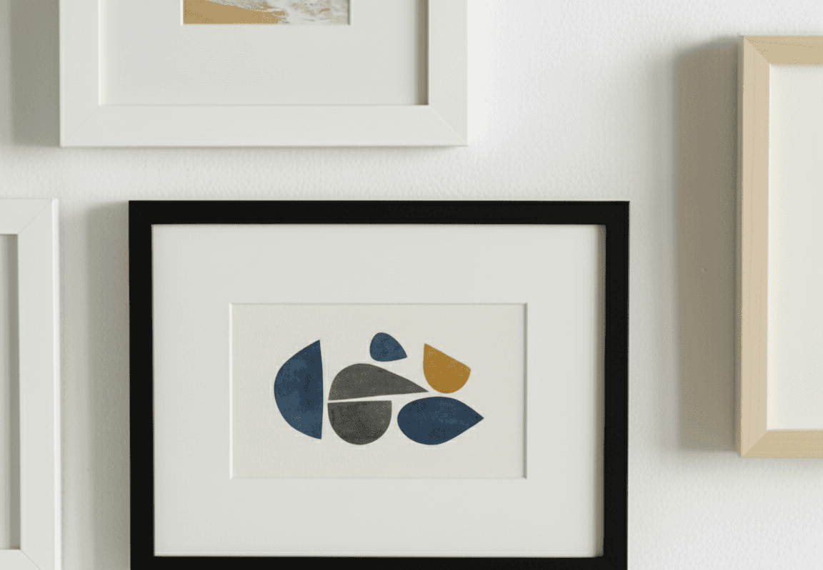 Wide Black custom frame displaying abstract geometric artwork with white mat demonstrating clean lines and contemporary styling on neutral wall