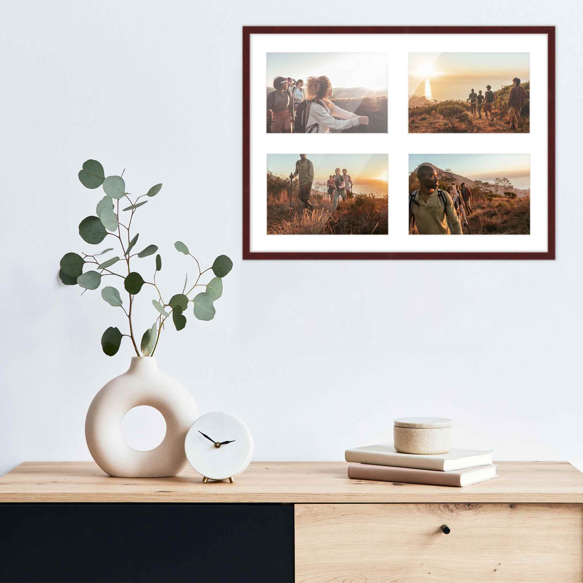 Brown Wood frame with white collage mat displaying national park photographs arranged above modern desk workspace