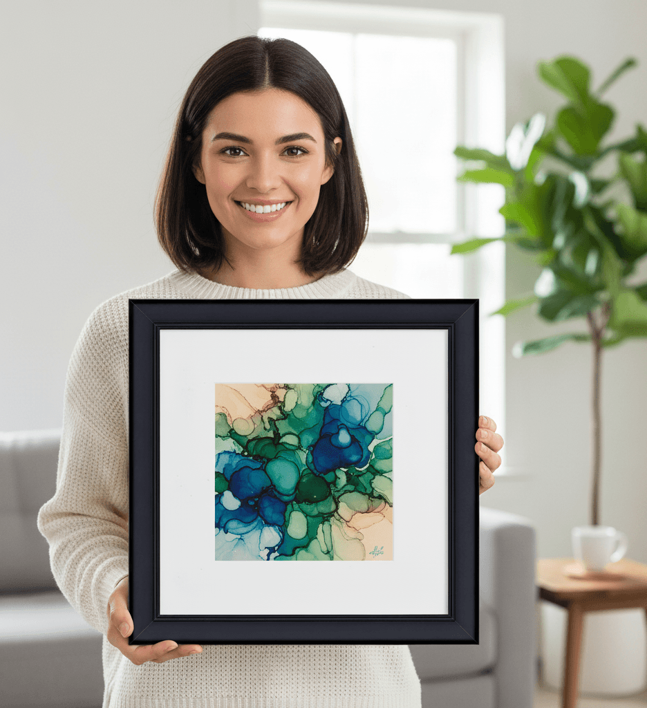 Person holding Modern Black framed abstract watercolor artwork with teal and green tones showing elegant presentation perfect for contemporary art display